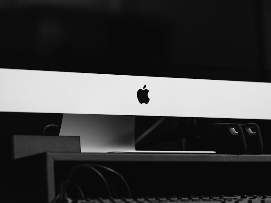 Sleek black and white minimalist desktop setup featuring modern technology in an indoor setting.